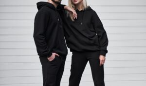 Woman,And,Man,Wear,Black,Hoodie,Without,A,Logo.,No